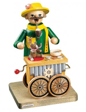 Smoker organ grinder with musical mechanism