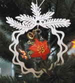 Tree decoration glass poinsettia, in the branch