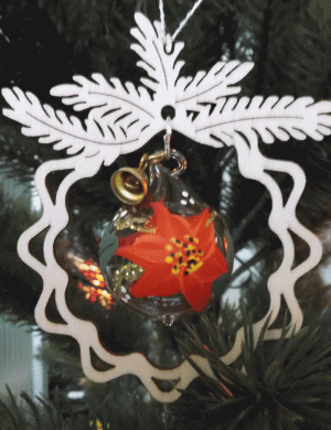 Tree decoration glass poinsettia, in the branch