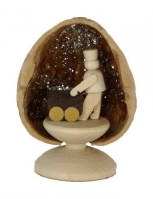 Miniature mining in walnut shell, standing