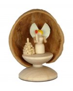 Miniature angel in walnut shell, standing