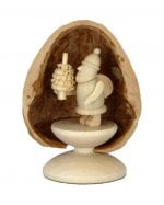 Miniature Santa Claus in walnut shell, standing