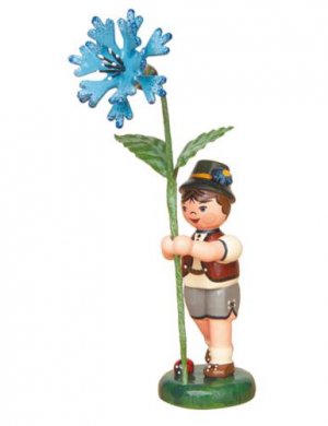Flower child boy with cornflower