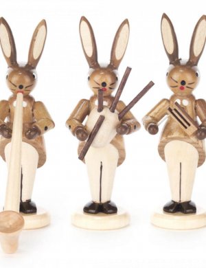 Rabbit trio with alphorn, bagpipe and rattle, nature