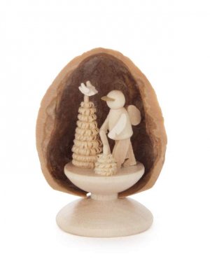 Miniature hiker in walnut shell, standing