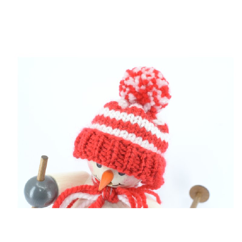 Smoking man snowman with red cap and skis