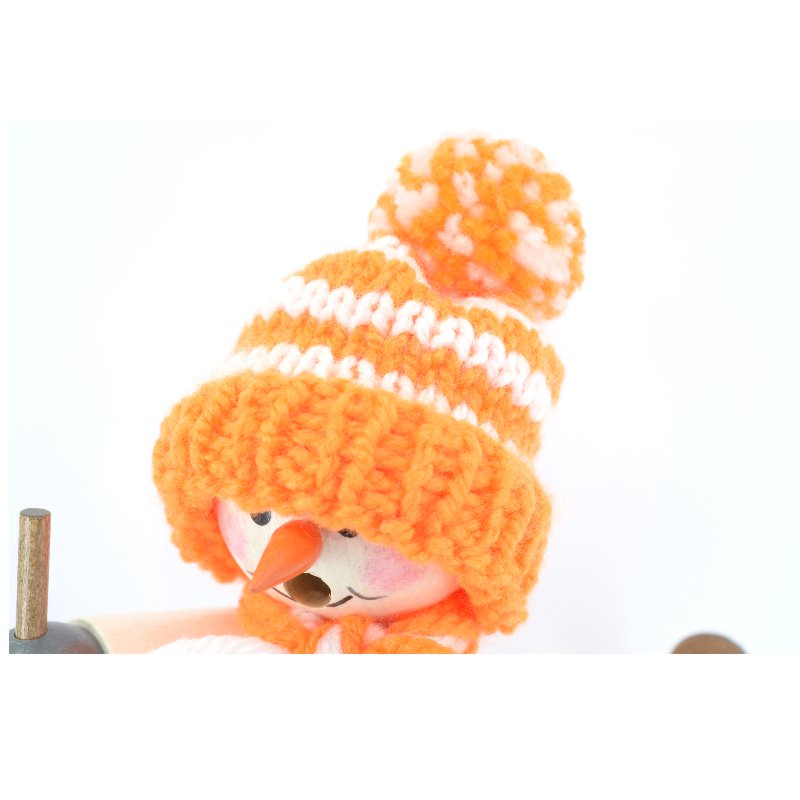 Smoking man snowman with orange cap and skis