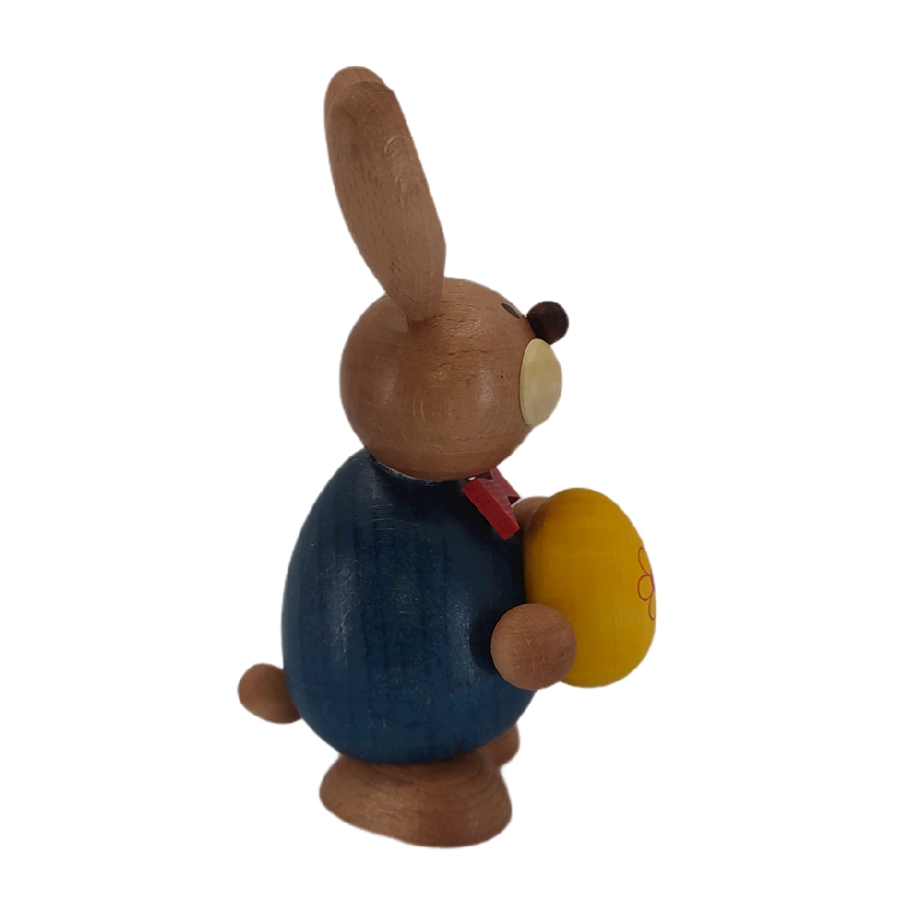 Easter bunny standing with a big yellow egg