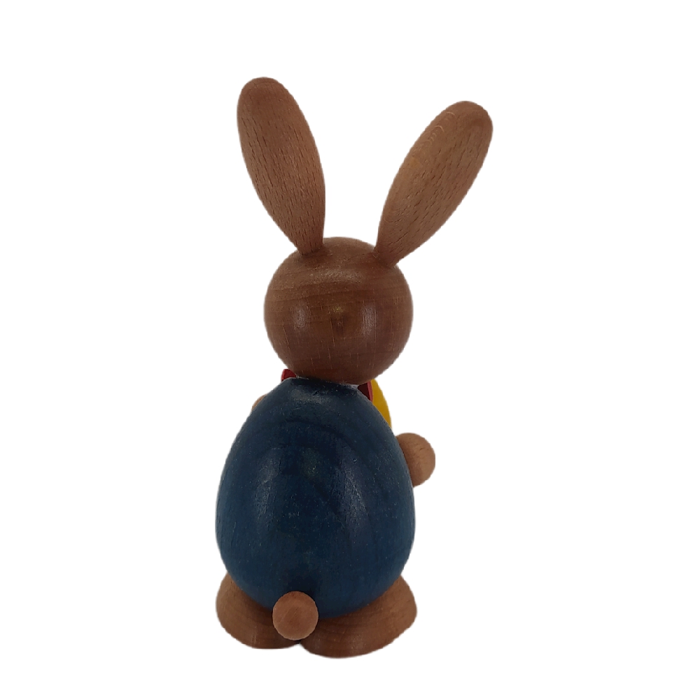 Easter bunny standing with a big yellow egg