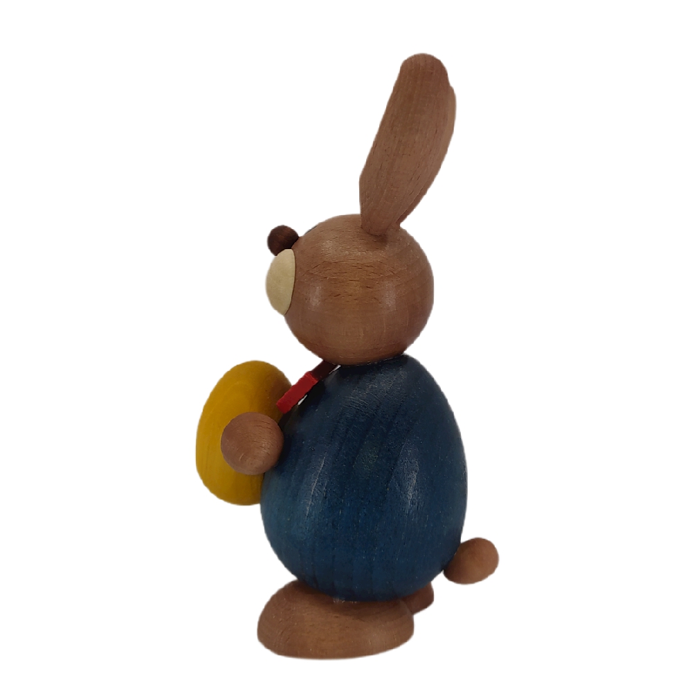Easter bunny standing with a big yellow egg