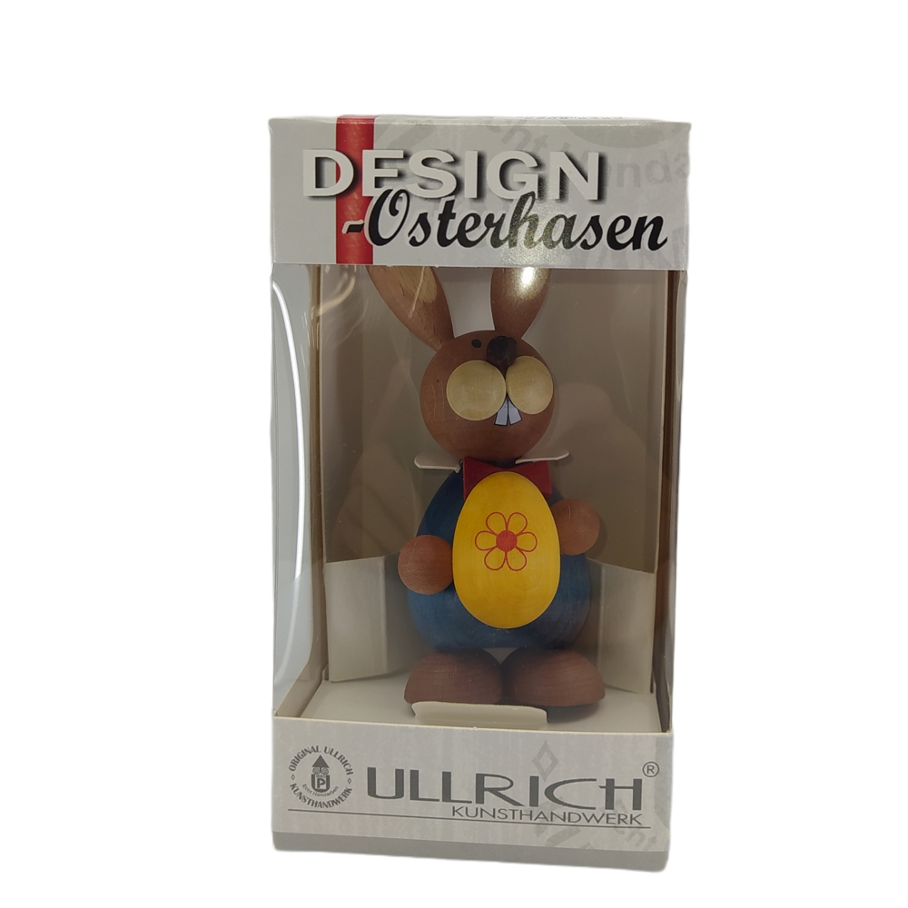 Easter bunny standing with a big yellow egg