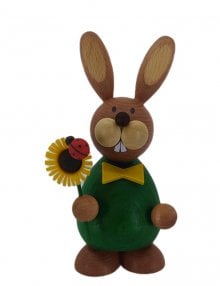 Easter bunny standing with sunflower