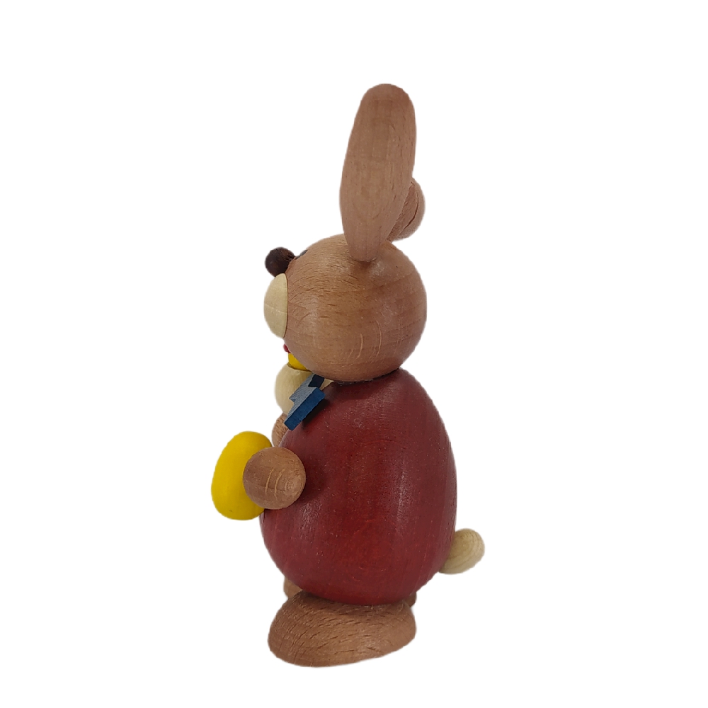 Easter bunny standing with hatching chicks