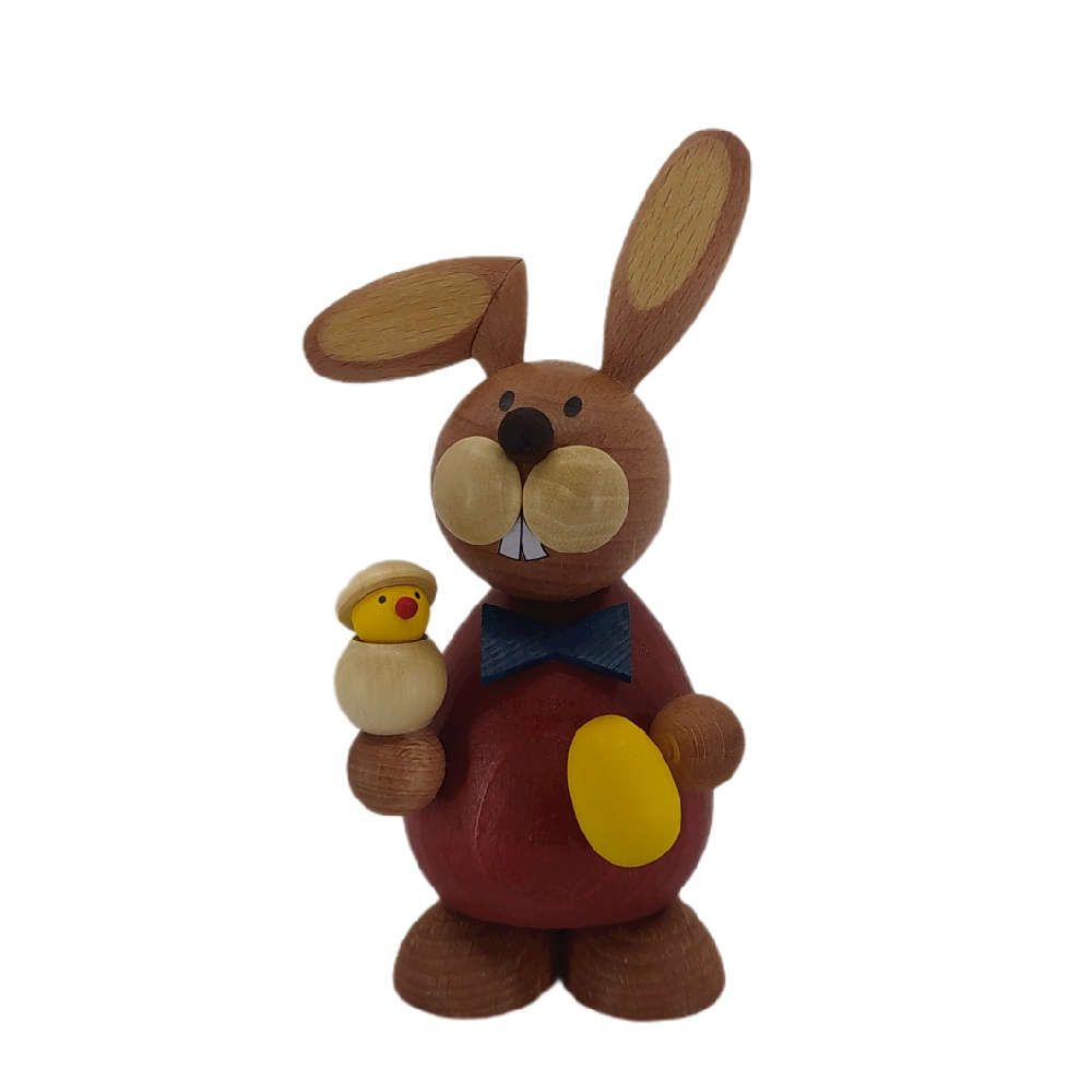 Easter bunny standing with hatching chicks