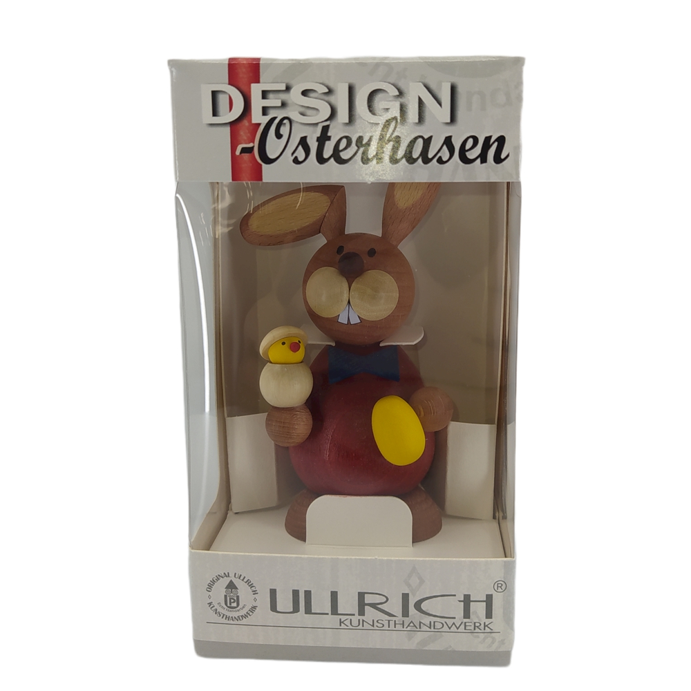 Easter bunny standing with hatching chicks