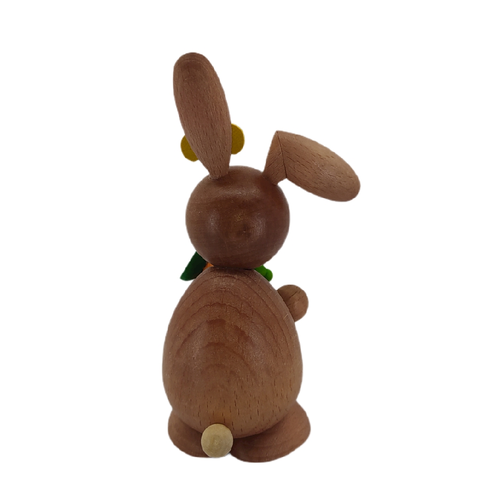 Easter bunny standing with carrot and caterpillar