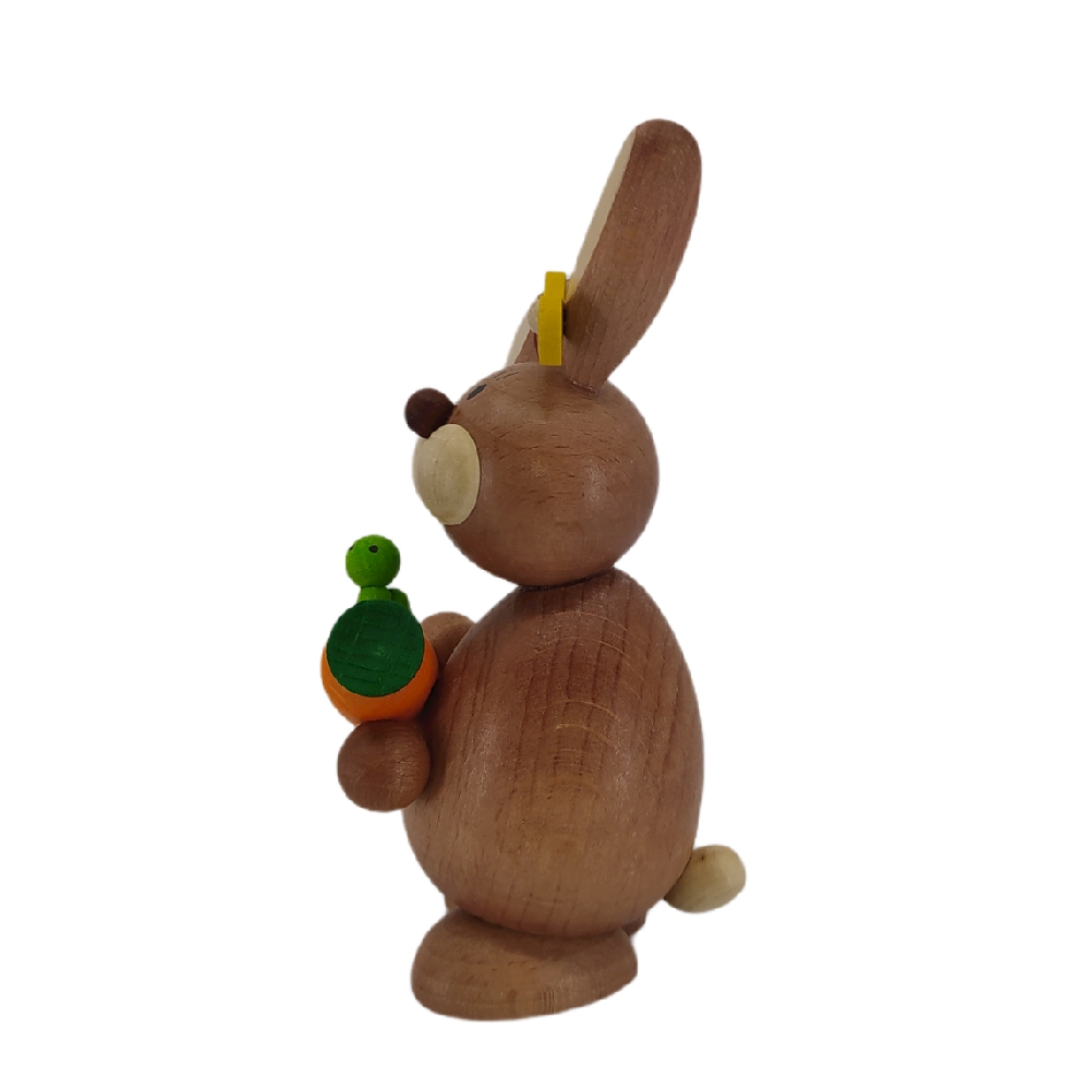 Easter bunny standing with carrot and caterpillar