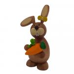 Easter bunny standing with carrot and caterpillar
