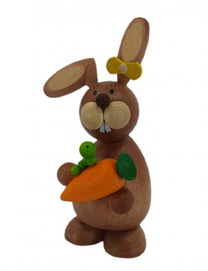 Easter bunny standing with carrot and caterpillar