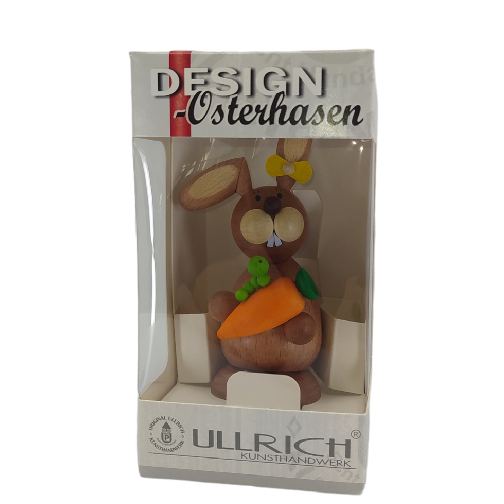 Easter bunny standing with carrot and caterpillar
