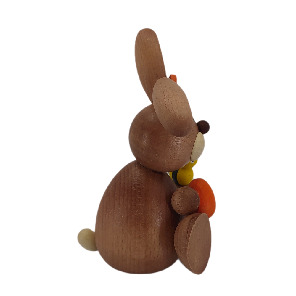Easter bunny sitting with egg and bee