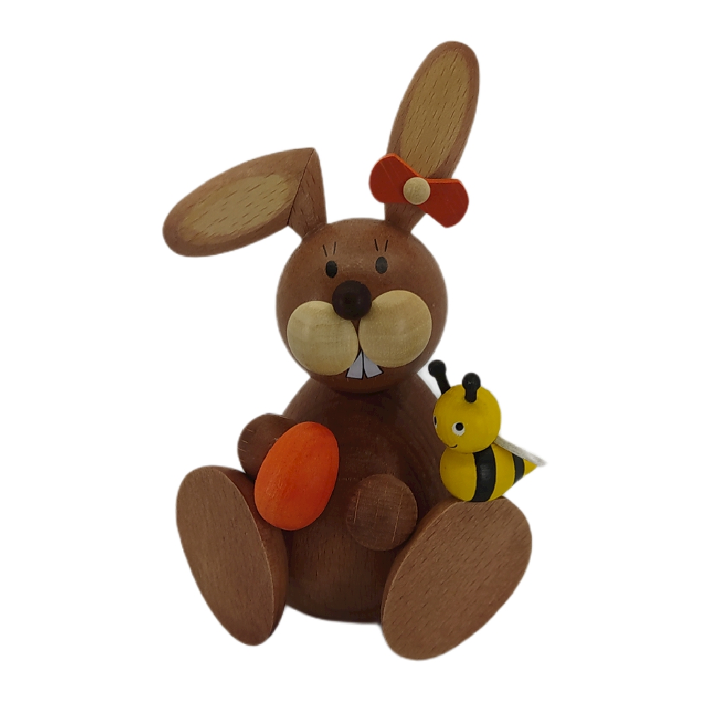 Easter bunny sitting with egg and bee