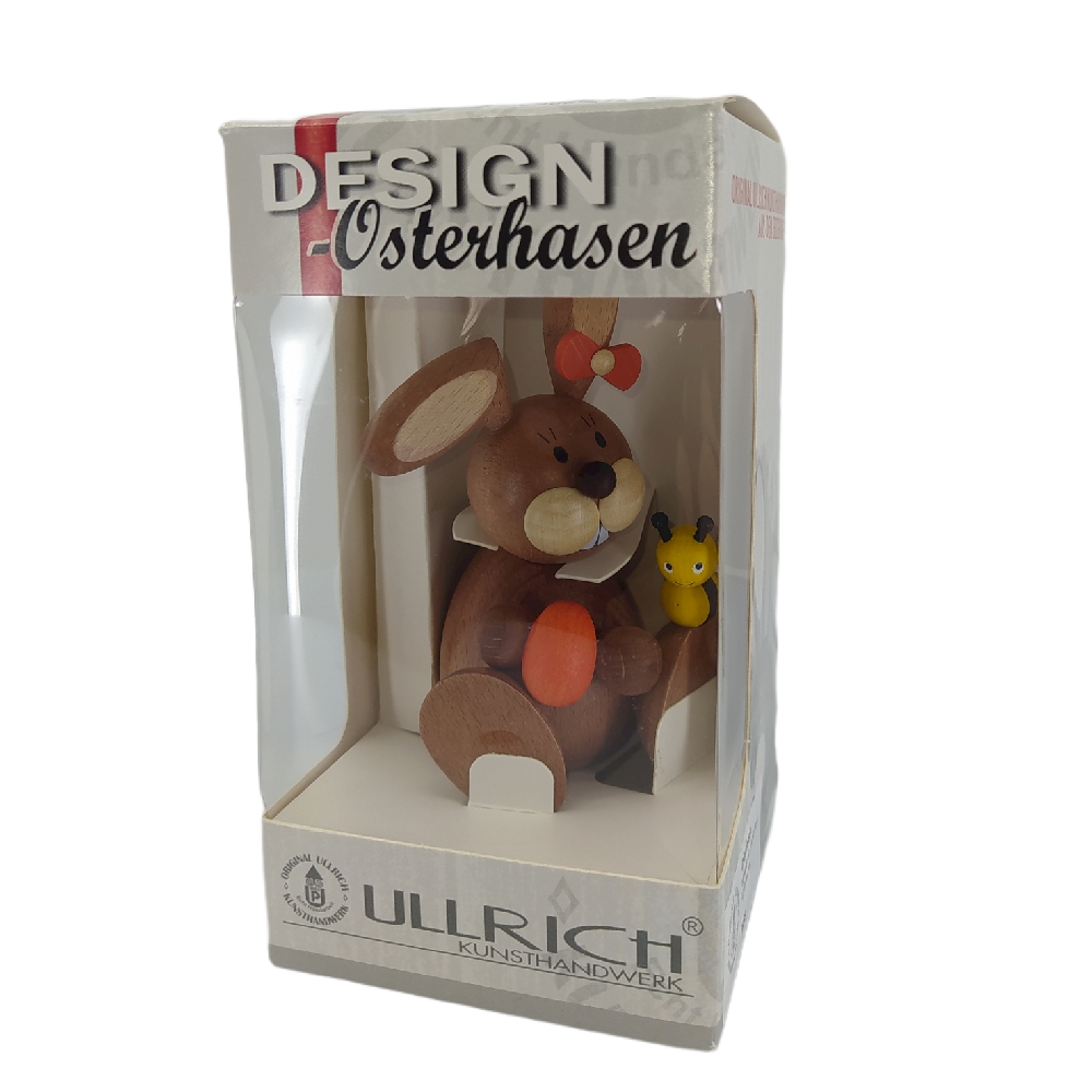 Easter bunny sitting with egg and bee