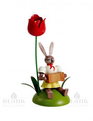 Blank easter bunny sitting with tulip and harmonica