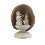 Miniature angler in walnut shell, standing