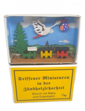 matchbox - Stork with baby and locomotive