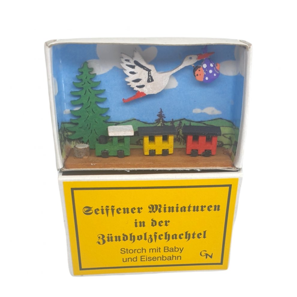 matchbox - Stork with baby and locomotive