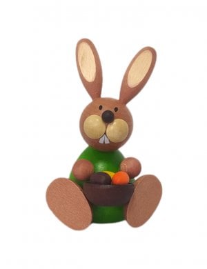 Easter bunny sitting with egg bowl