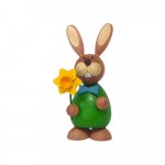 Easter bunny standing with daffodil