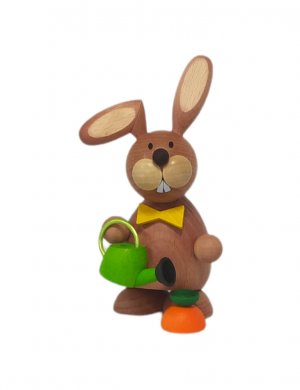 Easter bunny standing with a watering can