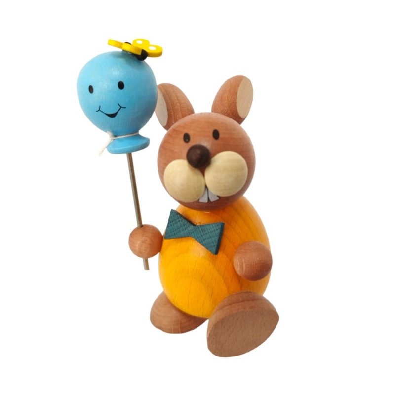 Easter bunny standing with balloon