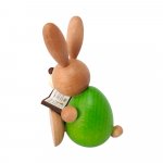 Easter bunny sitting with book
