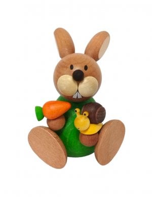 Easter bunny sitting with snail and carrot
