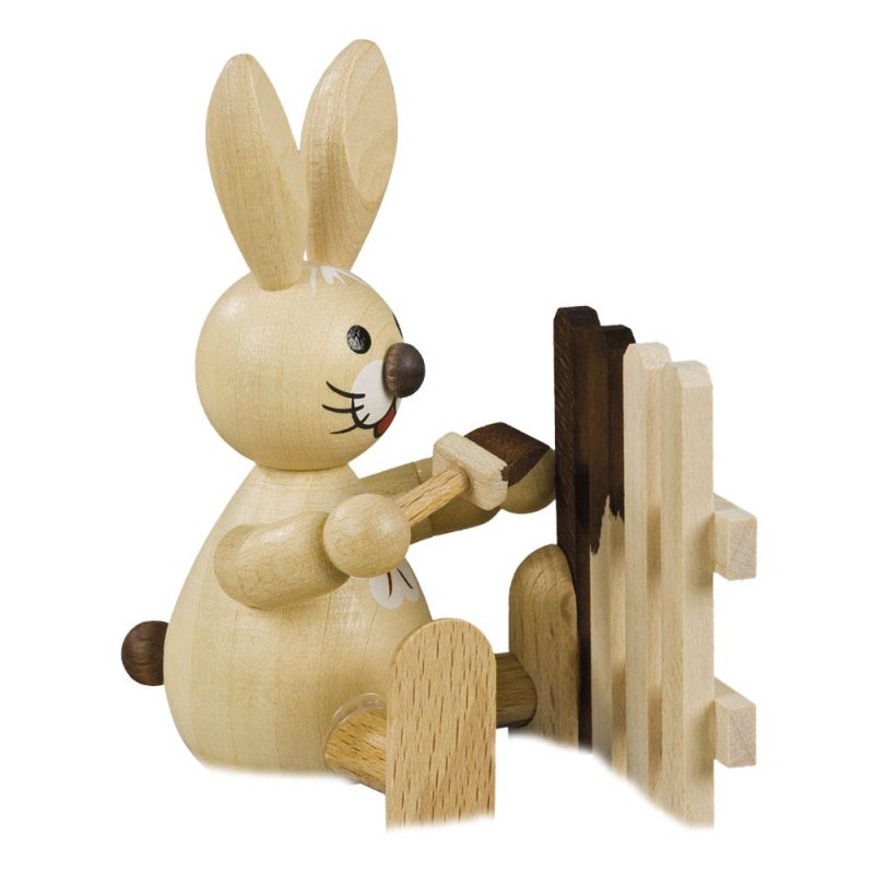 Easter bunny painting the fence