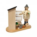 Smoking man rabbit breeder with rabbit hutch