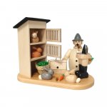 Smoking man rabbit breeder with rabbit hutch