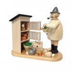 Smoking man rabbit breeder with rabbit hutch