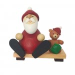 Santa Claus with teddy on bench