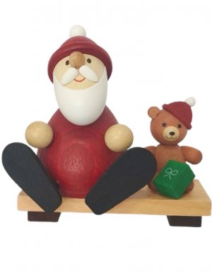 Santa Claus with teddy on bench
