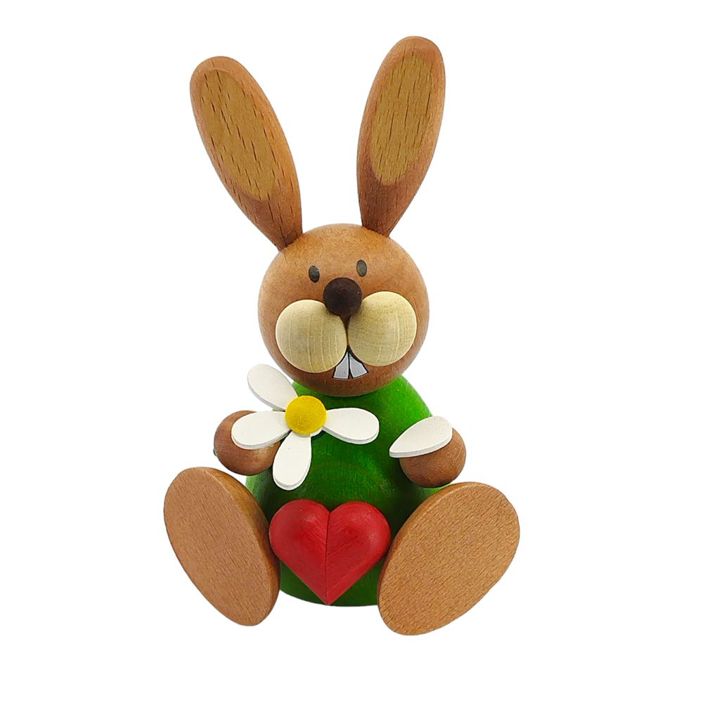 Easter bunny sitting with flower and heart