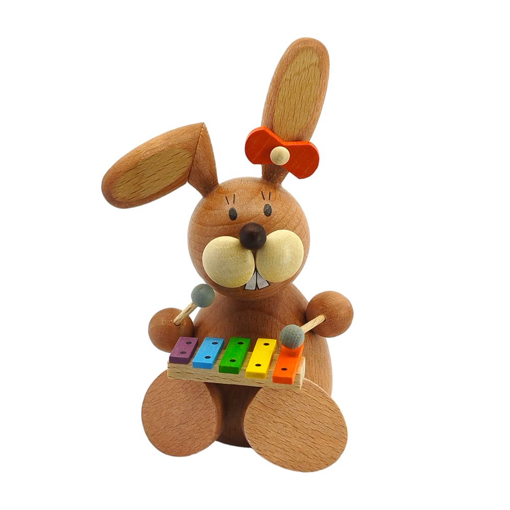 Easter bunny sitting with xylophone