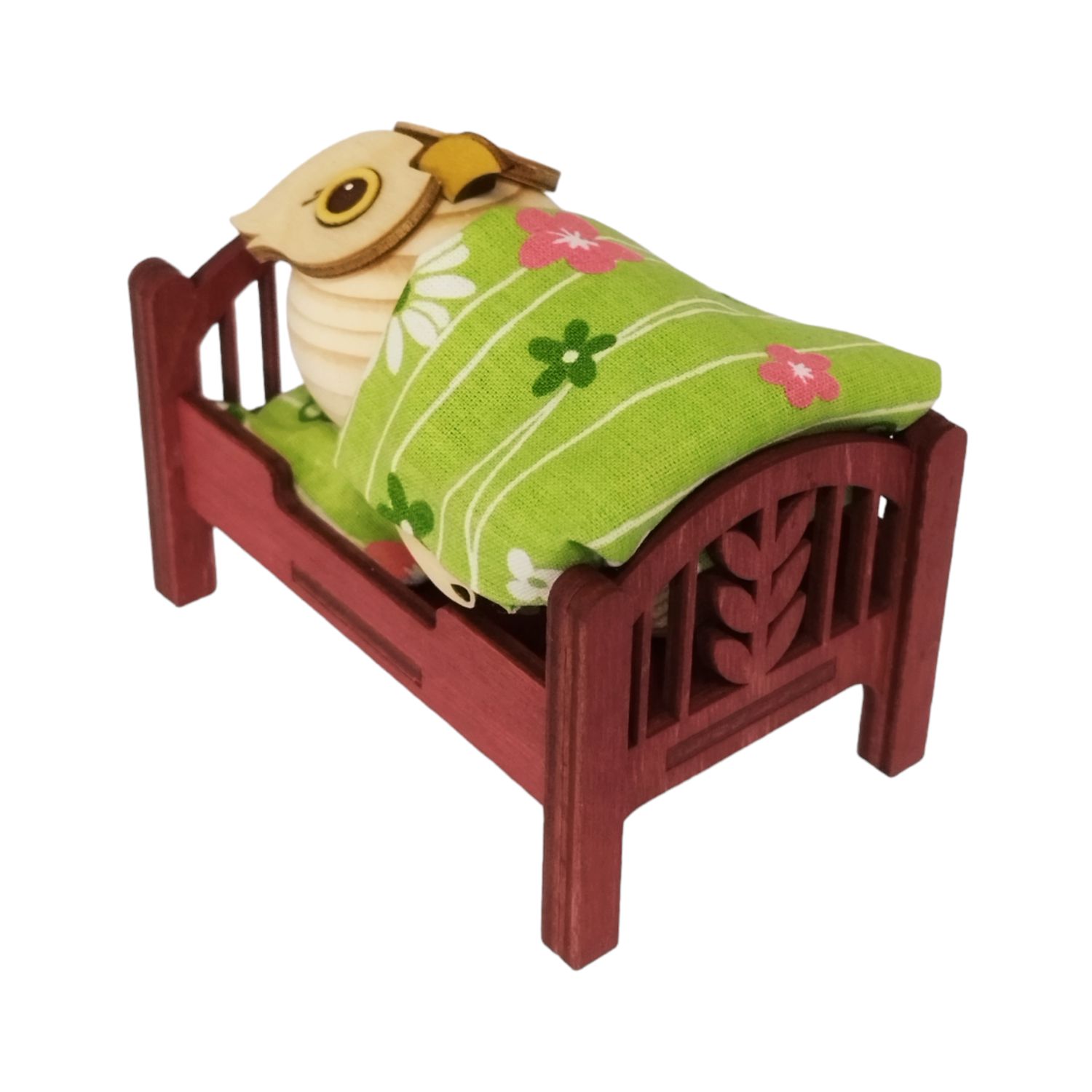 Wooden figure mini owl in bed